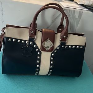(M.C.) ladies leather bag. in very nice match of color, dark blue, brown and tan
